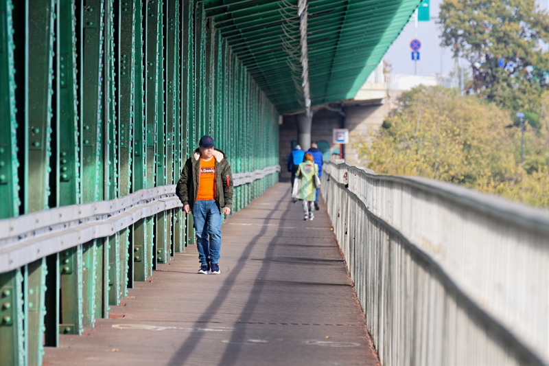 26 - Scene on the Gdański Bridge in Warsaw, Poland, featuring green structural beams and a pedestrian walkway